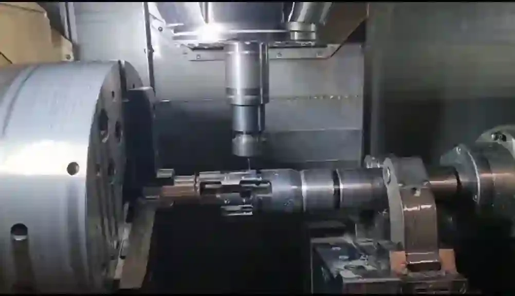 Real CNC machining of a shaft inside a production machine — example from completed work